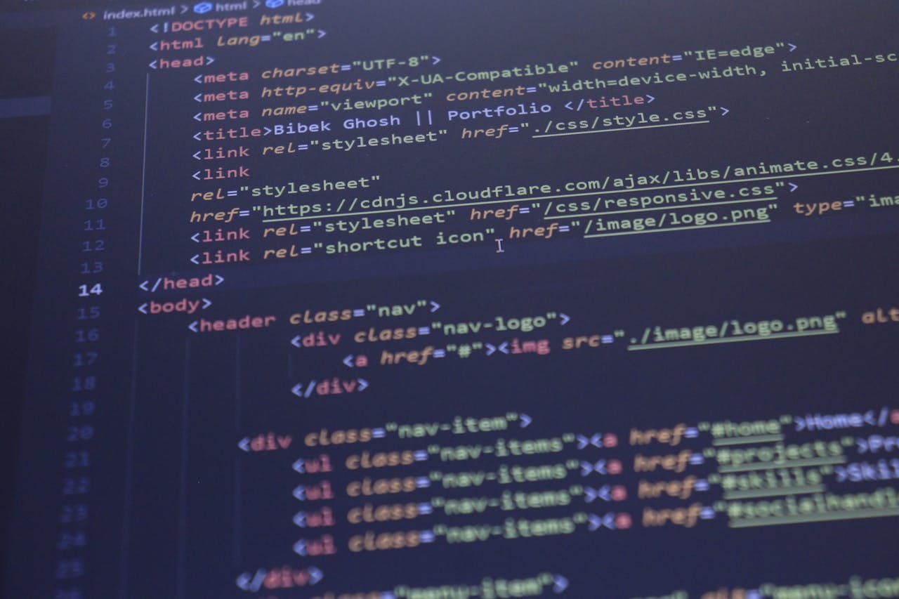 our-services-3 Close-up view of HTML and CSS code displayed on a computer screen, ideal for programming and technology themes.